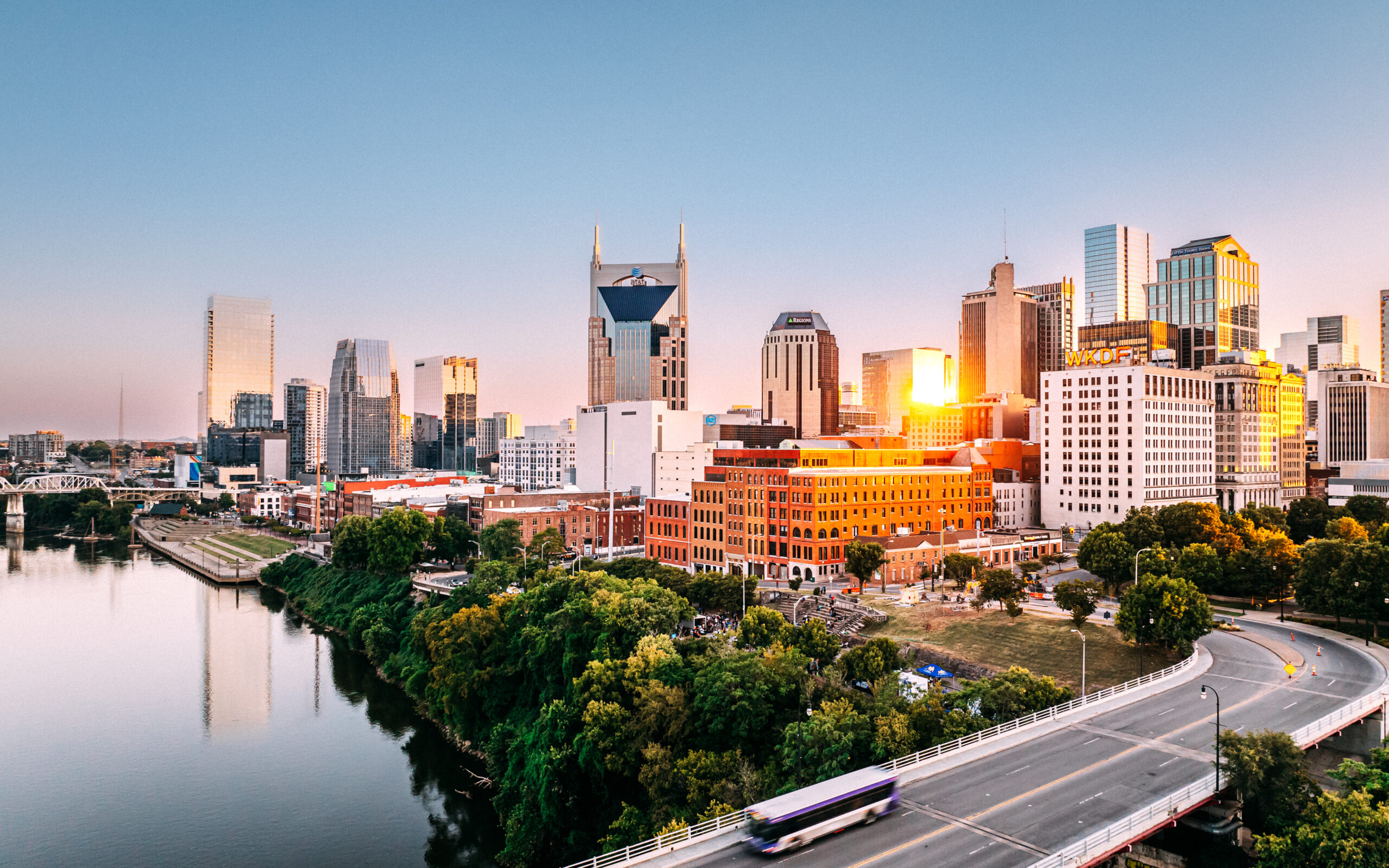 Public Transportation Bus crossing the Woodland St. Bridge in Downtown Nashville, Tennessee across the Cumberland River